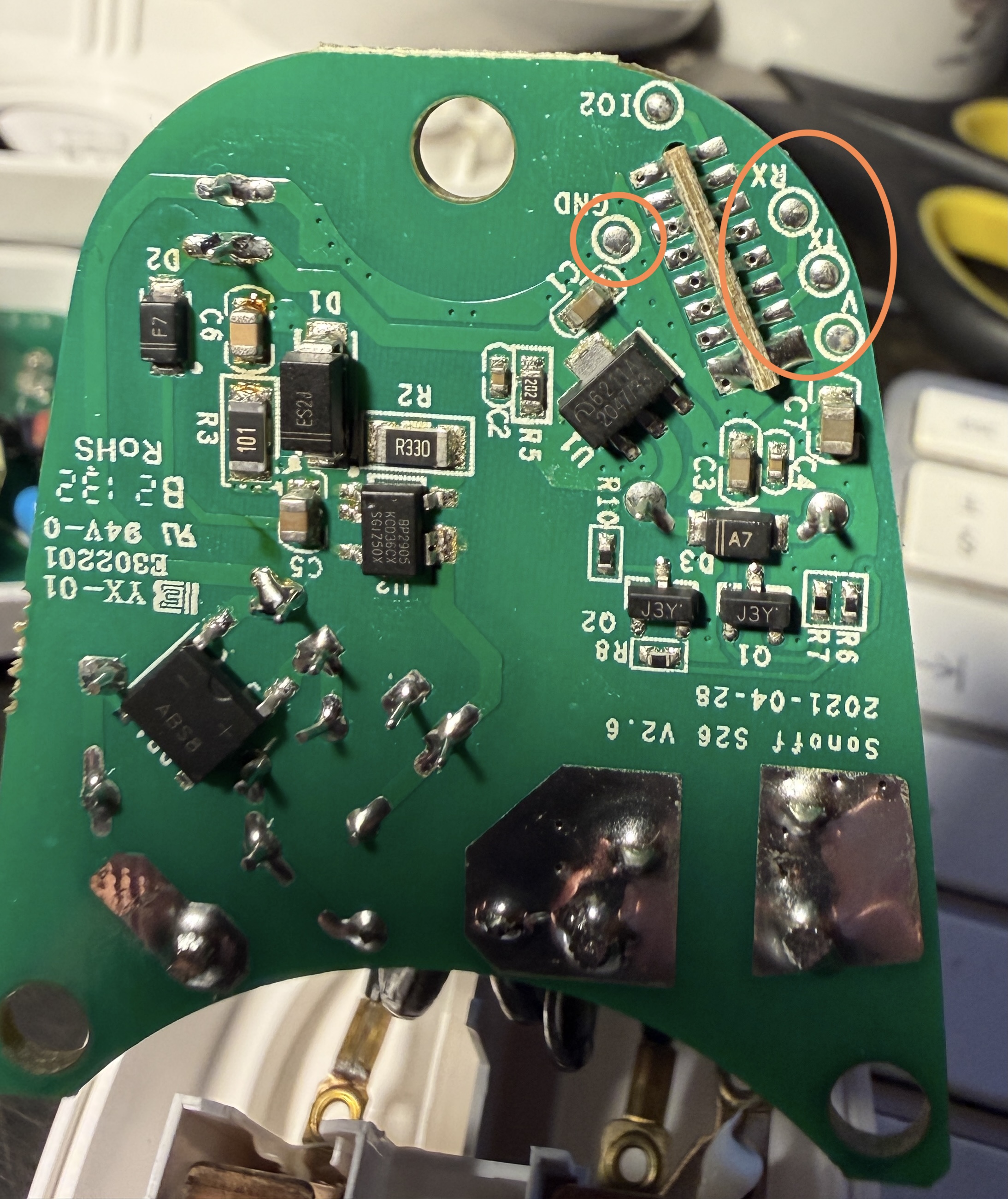 S26R2 reverse of PCB — orange circles show the separate GND pad and the TX/RX/VCC cluster